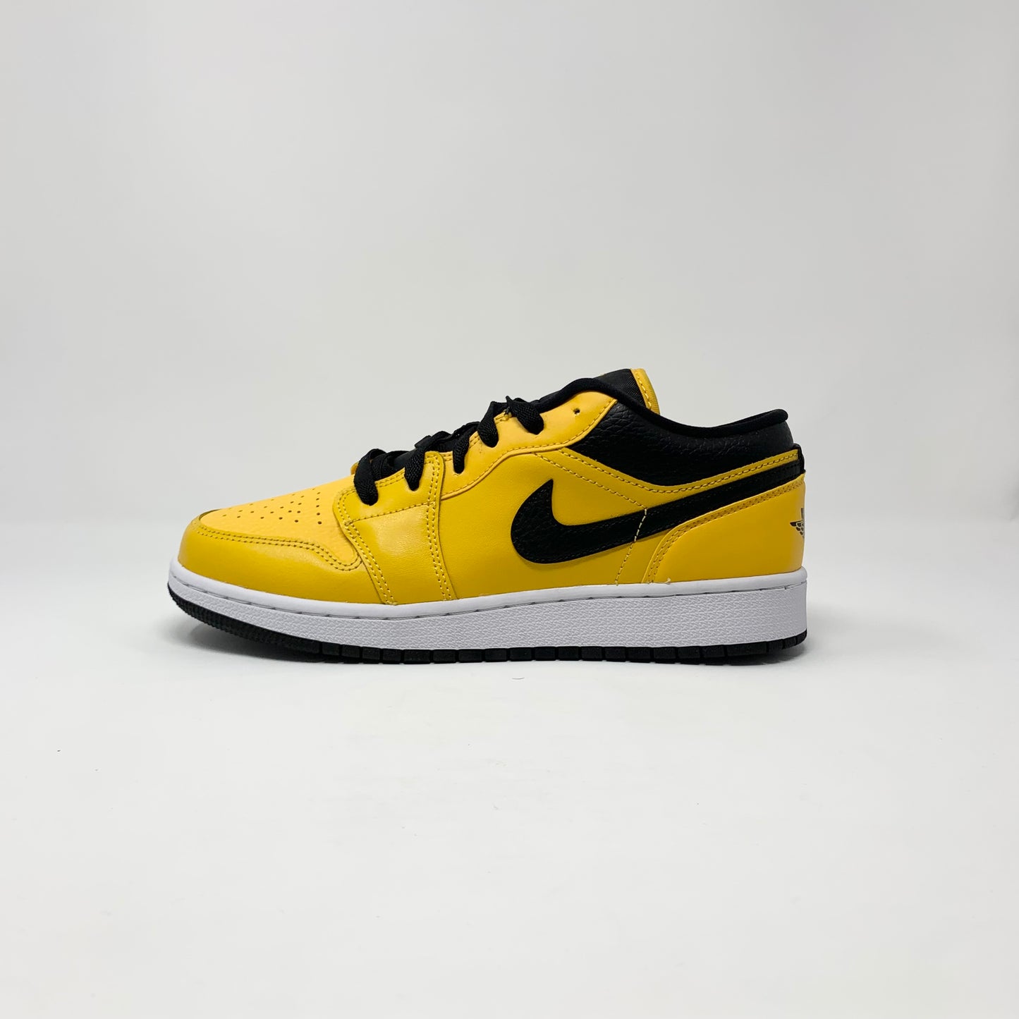 Jordan 1 Low “University Gold” (GS)